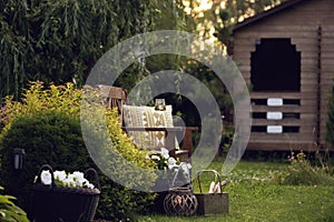 evening relax in cottage summer garden with glass of wine.