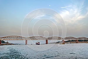 Evening scene from boat cruising in Ganges showing Double Decker Malviya bridge for railway as well as road in Varanasi