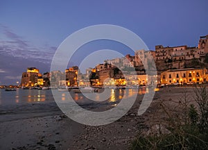 Evening scene in an harbour in Sicily