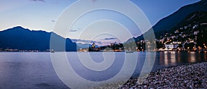 Evening scene at lago di garda: Beach, lake and village, Panorama photo