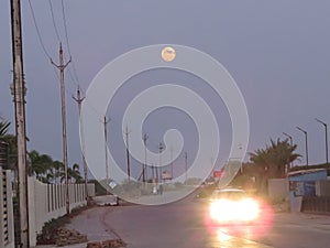 Dusky Road Horizon, with Full Moon in Sky.