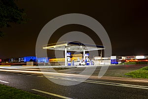 Evening at a selfservice gas station at the A44 highway in Sassenheim photo