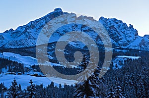 Evening shadows on a cold winter day in the Dolomites Mountains photo