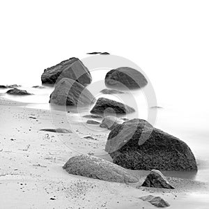 Evening shore sea water and stones on a beach