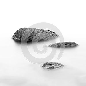 Evening shore sea water and stones on a beach