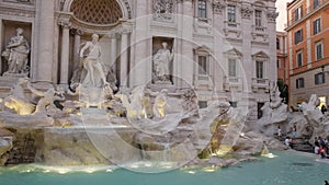 Evening shot of a floodlit trevi fountain in rome