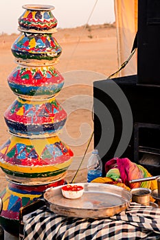 Evening shot showing the props like clayware pots, clay pots, dishes, kettle, mics and more as props for traditional photo