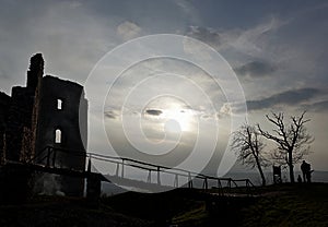 Evening silhouette of bridge and ruins of Oponice fortress, Slovakia