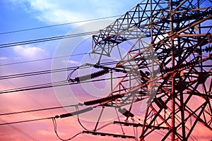 In the evening, the silhouette of high voltage towers