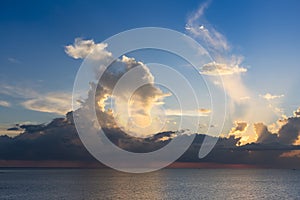 Evening sky with dramatic clouds over the sea with sculpted 3D cloudscape