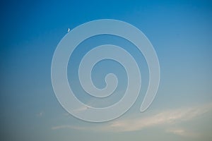 Evening sky and moon and bird