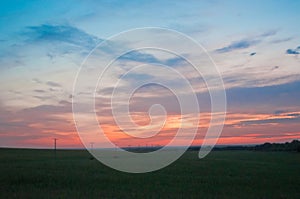 Evening sky. Sunset in the field