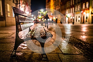 Evening street with benches and lanterns. Night European city