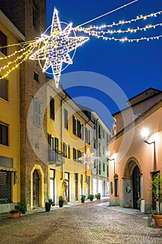 Evening street in historic center illuminated and decorated for Christmas holidays