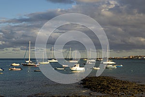 Evening sun on boats in Corralejo harbor harbour