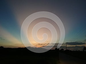 Evening sun, dark sky