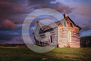 Evening sun shining on an old derelict house.