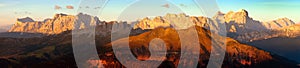Evening sunset colored panoramic view of Alps Dolomites mountains from Col di Lana, Tofana, Fanes and others, Italian dolomites photo