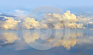 Evening sunset seascape with clouds and water reflection waves in Baltic sea