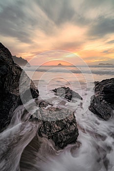 Evening Sunset at a Tropical Rocky Beach