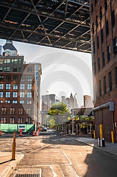 Evening sunset view of the Brooklyn bridge from under the Manhattan brdige
