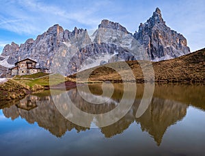 Evening twilight autumn alpine Dolomites mountain scene, Trento, Italy. Lake or Laghetto Baita Segantini view