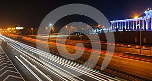 Evening view of the Almaty city. Light trails on motorway highway