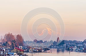 Evening view of the Columbia River with floating houses and boats and yachts moored at the berths on the background of the
