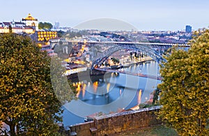 Evening view of Dom Luis I Bridge and Duoro river, Porto, Portug