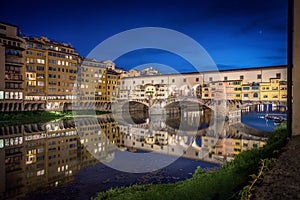 Evening view of the famous bridge Ponte Vecchio on the river Arno in Florence, Italy.