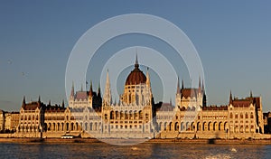 Evening view of the illuminated building of the Hungarian Parliament in Budapest.