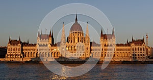 Evening view of the illuminated building of the Hungarian Parliament in Budapest.