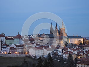 Evening view of illuminated St. Vitus Cathedral gothic churche and Prague Castle panorama, hradcany and Mala Strana