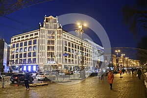 Evening view of illuminated TSUM or Central department store building on Khreshchatyk, main street of Kyiv, Ukraine