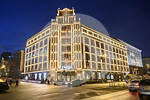 Evening view of illuminated TSUM or Central department store building on Khreshchatyk, main street of Kyiv, Ukraine