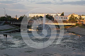 Evening view of the Kopa river in the center of the city of Kokshetau, Republic of Kazakhstan in summer