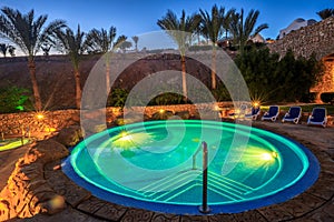 Evening view for luxury swimming pool in night illumination