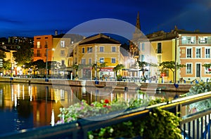 Evening view of Martigues divided by canals with colorful buildings, France