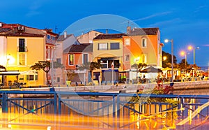 Evening view of Martigues divided by canals with colorful buildings, France
