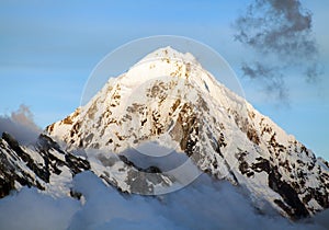 Evening view of Mount Salkantay in the middle of clouds