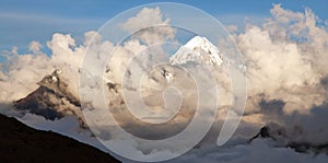 Evening view of Mount Salkantay in the middle of clouds