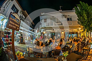 Evening view of the narrow streets, traditional taverns, Greek Mediterranean architecture, Skiathos old town, Greece