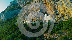 Evening view of Ostrog orthodox monastery in Montenegro or Crna gora, popular pilgrimage point in the balkans, viewed from drone