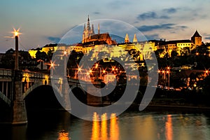 Evening view of Prazsky Hrad and bridge over Vltava river in Prague