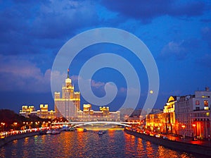 Evening view on the river, a residential skyscraper on Kotelnicheskaya Embankment, Moscow River, Ustinsky bridge. Moscow, Russia