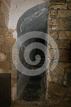 Evening view  from Saint Mark Street to the alley passing under the houses in the old city of Jerusalem, Israel