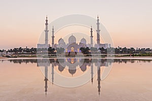 Evening view of Sheikh Zayed Grand Mosque in Abu Dhabi reflecting in a water, United Arab Emirate