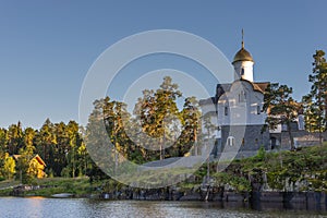 Evening view of Smolensk Skete from the lake. Horizontal frame.