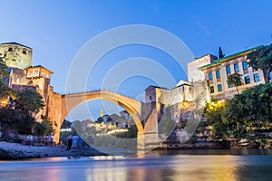 Evening view of Stari most (Old Bridge) and old stone buildings in Mostar. Bosnia and Herzegovi