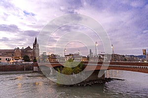 Evening view of Verona. Autumn in Verona, Italy. Scenery with Adige River and Ponte di Pietra. Famous Verona landmark. Ponte di